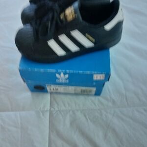 Adidas Kids Black and White Sneakers with Gold Accents